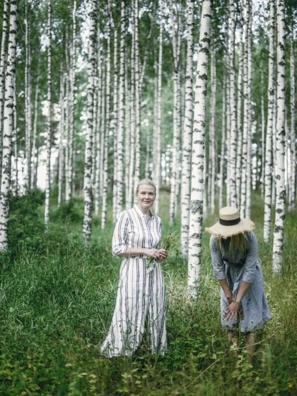 Niki Nwd Co Founder Kirsi standing in a birch forest.