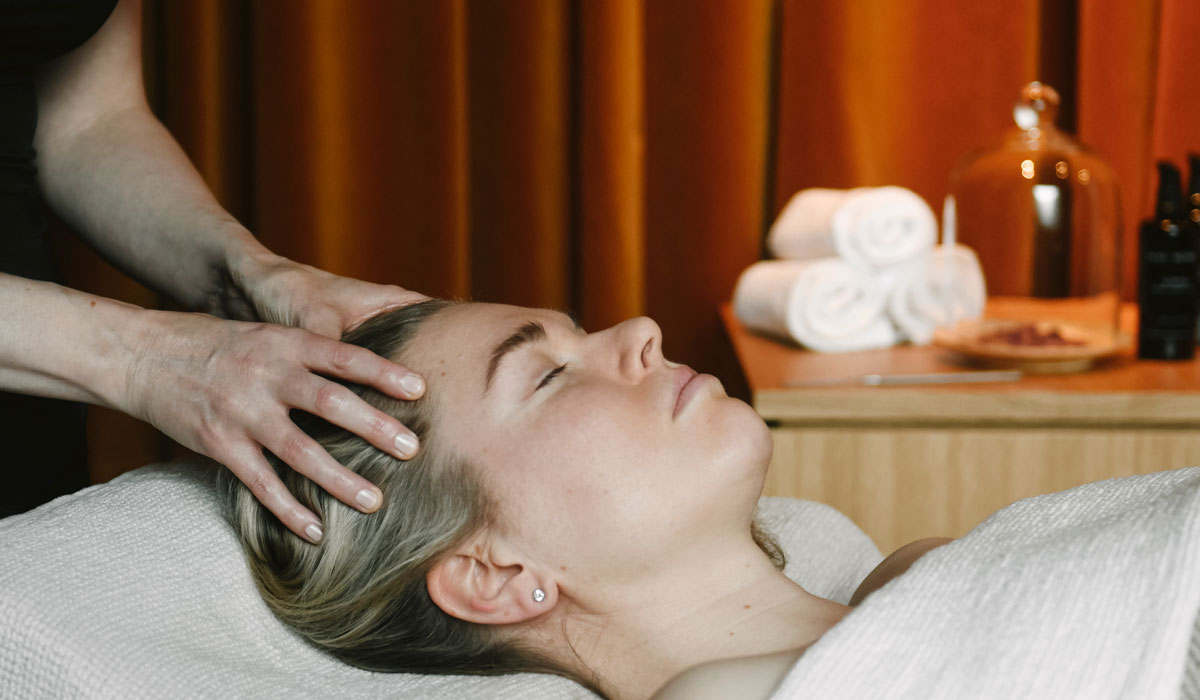 Head massage awakens circulation — Niki Newd® Nordic Facial fuses ancient touch with modern purity.