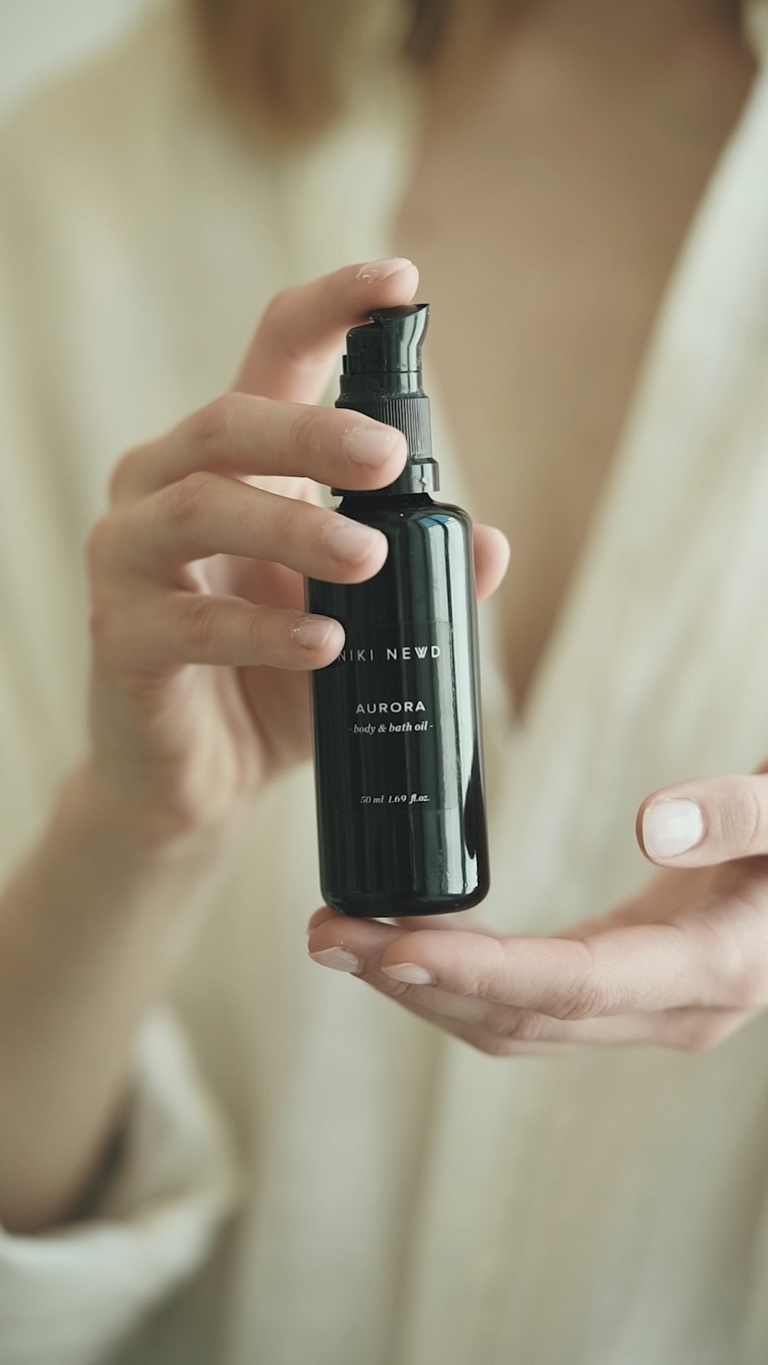 Niki Newd® Aurora — body oil after shower to lock in moisture and soften dry skin naturally.