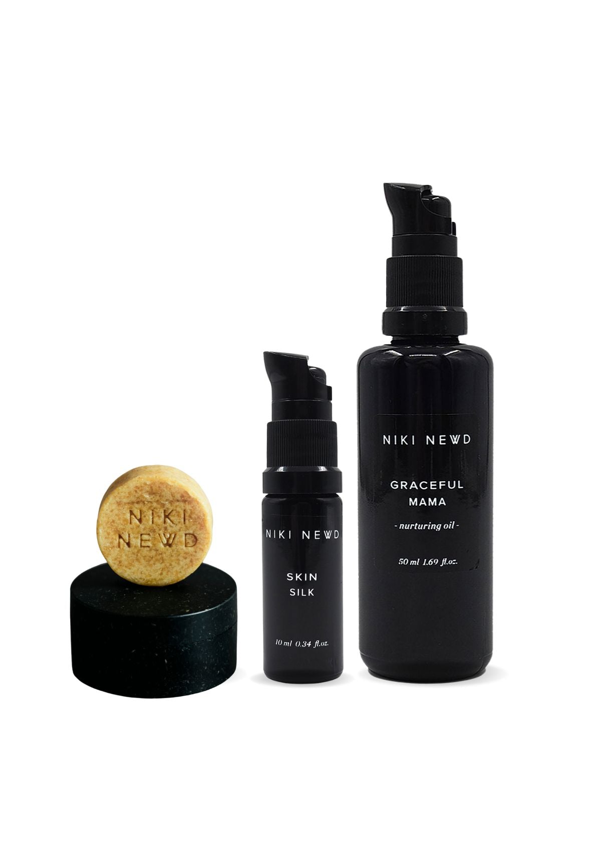 Niki Newd skincare product set including a bar, serum, and oil serum.