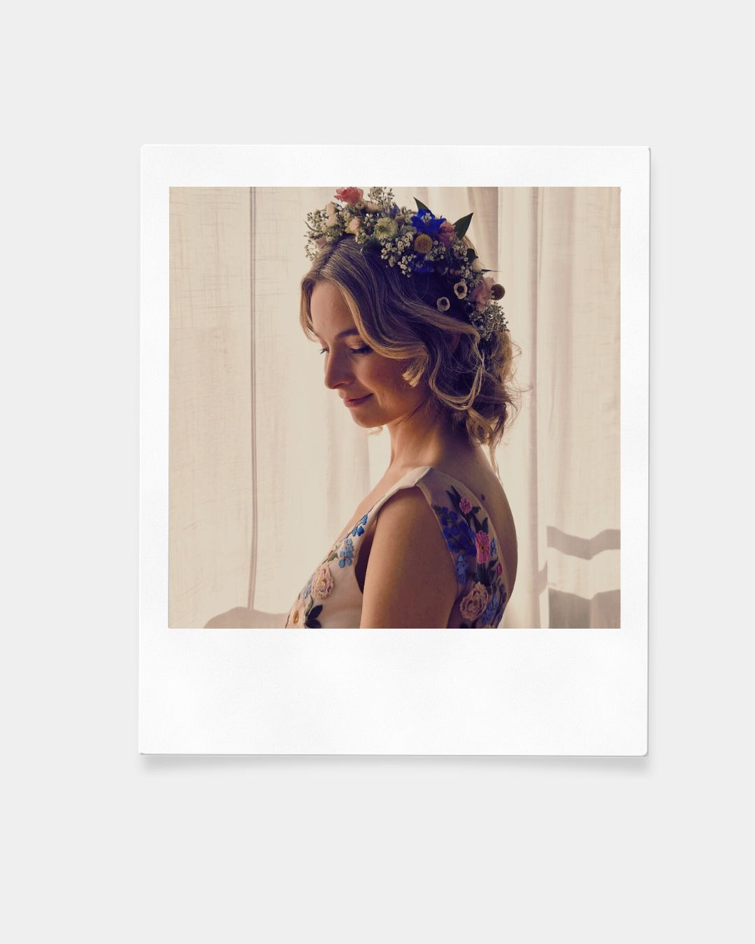 Bridal hairstyle with a floral hairpiece. Hair and makeup by Niki Newd Studio.