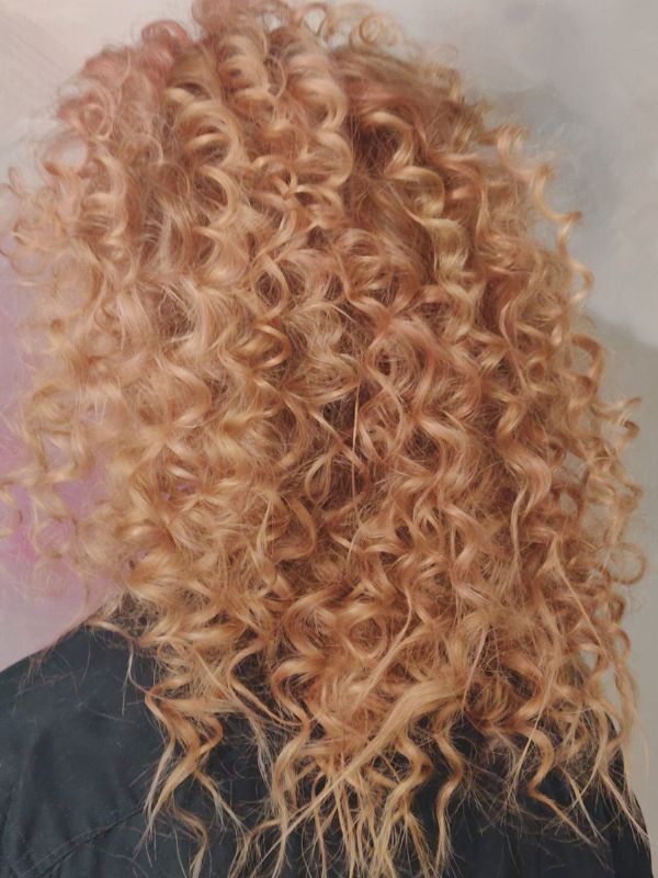 Voluminous curls styled by Hair Studio Niki Newd® — a soft, glamorous cloud of curls perfect for parties and special celebrations.
