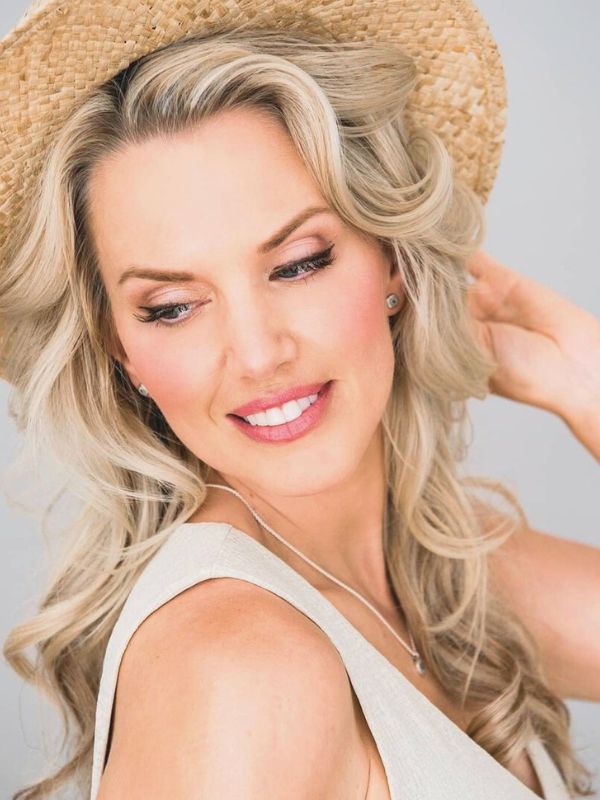 Professional hairstyle and makeup created at Niki Newd® Hair Studio for a photo shoot – polished, radiant look with natural elegance.