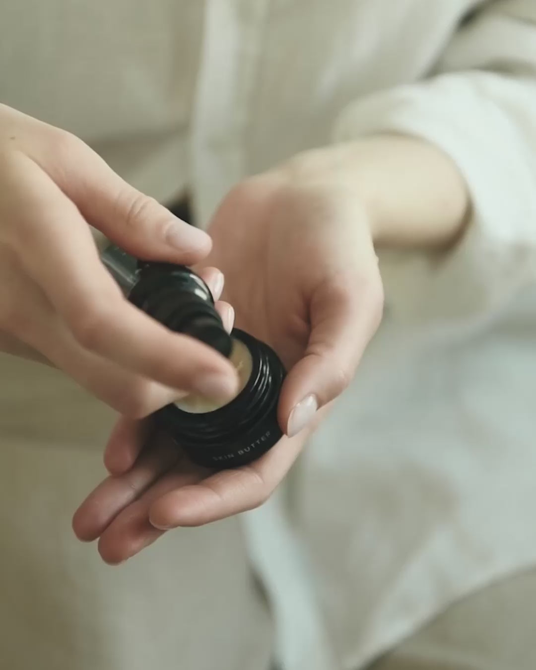 Close-up video showing Niki Newd Skin Mist being blended with cream in the palm to create a fresh emulsion.