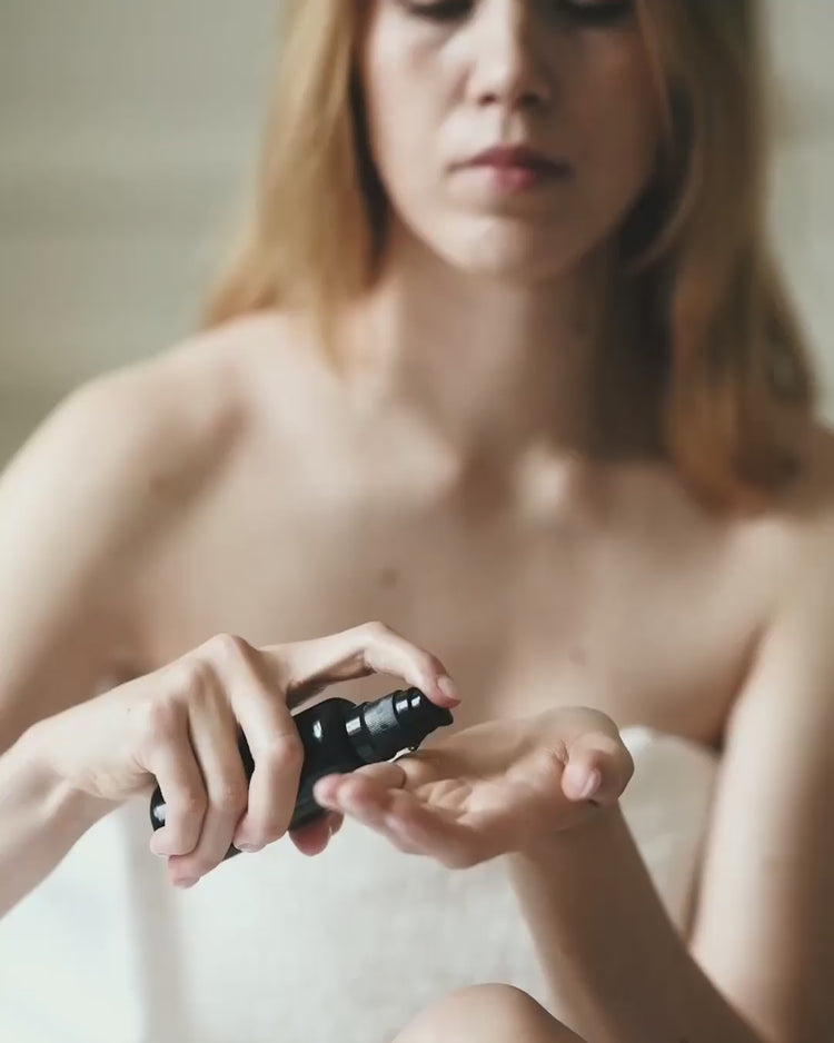 Close-up video showing the rich texture of Niki Newd oil serum settling into a soft, luminous finish on the skin.